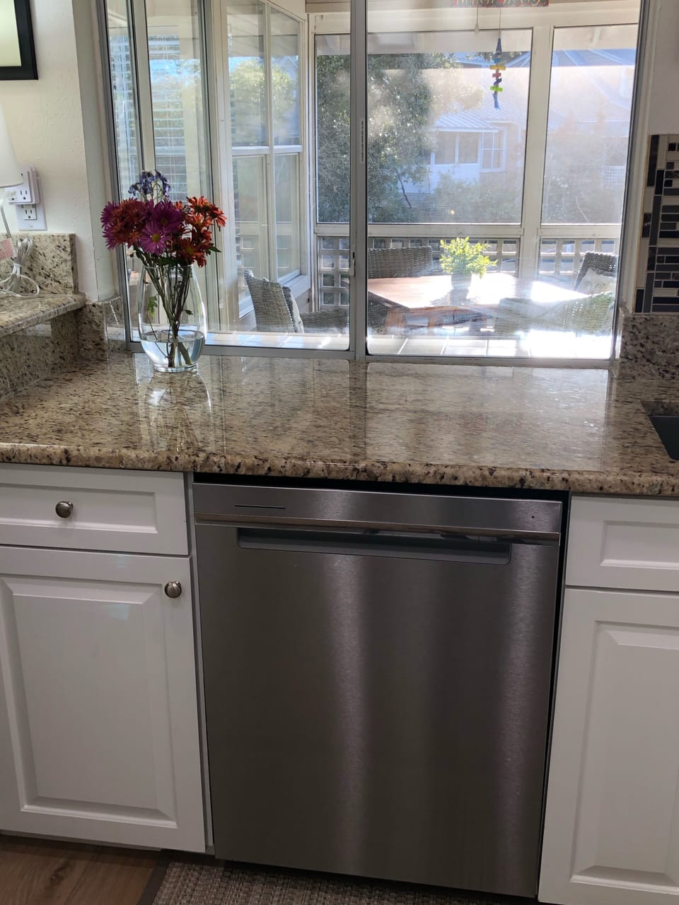 Kitchen with pass-thru window to screened-in porch