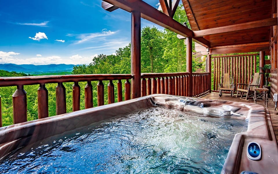 Relax in the hot tub with breathtaking views of the Smoky Mountains.