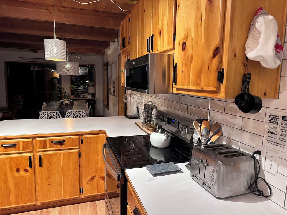 Updated tile backsplash with solid pine cabinets