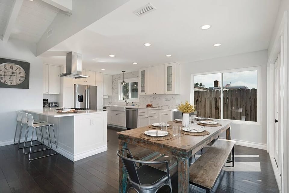 The indoor dining has easy access to the kitchen and living room for quick food transfers