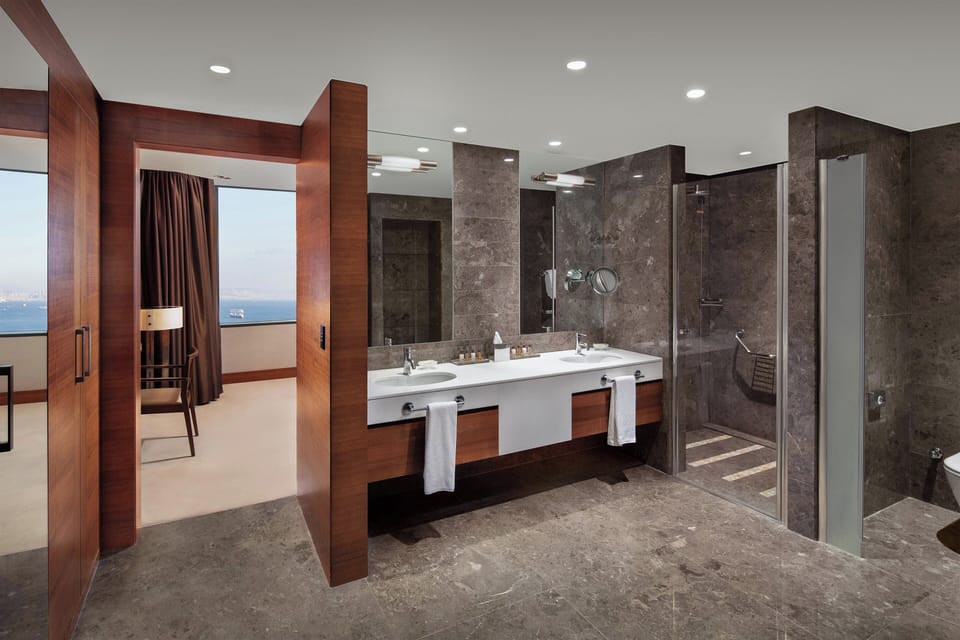 Executive Suite, 1 King Bed, Sea View | Bathroom | Combined shower/tub, eco-friendly toiletries, hair dryer, bathrobes