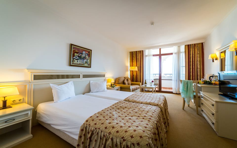 Double or Twin Room, Sea View | Minibar, in-room safe, desk, blackout drapes