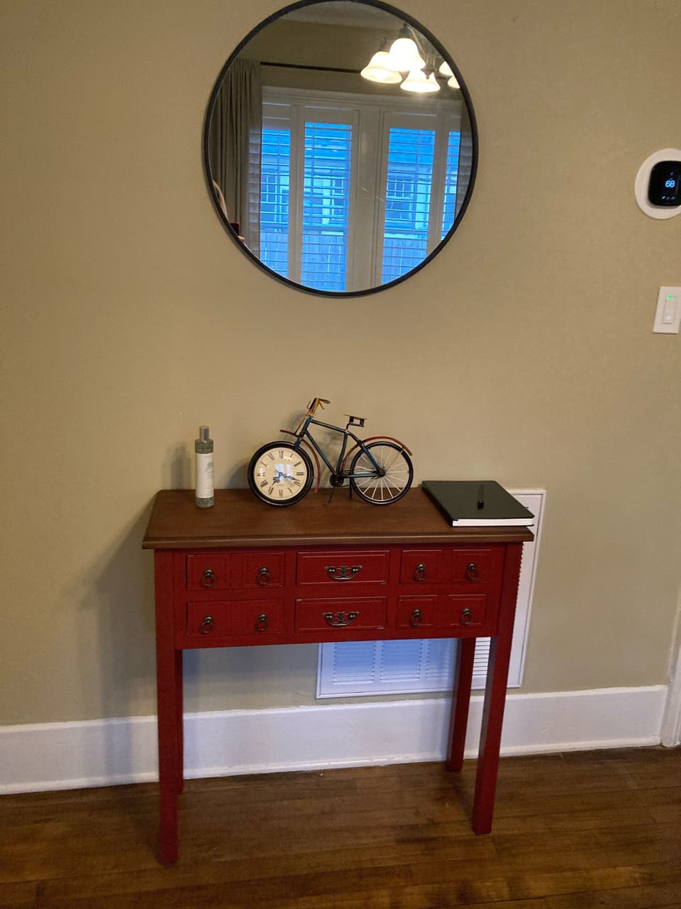 Side table holds some useful items and local business cards/info