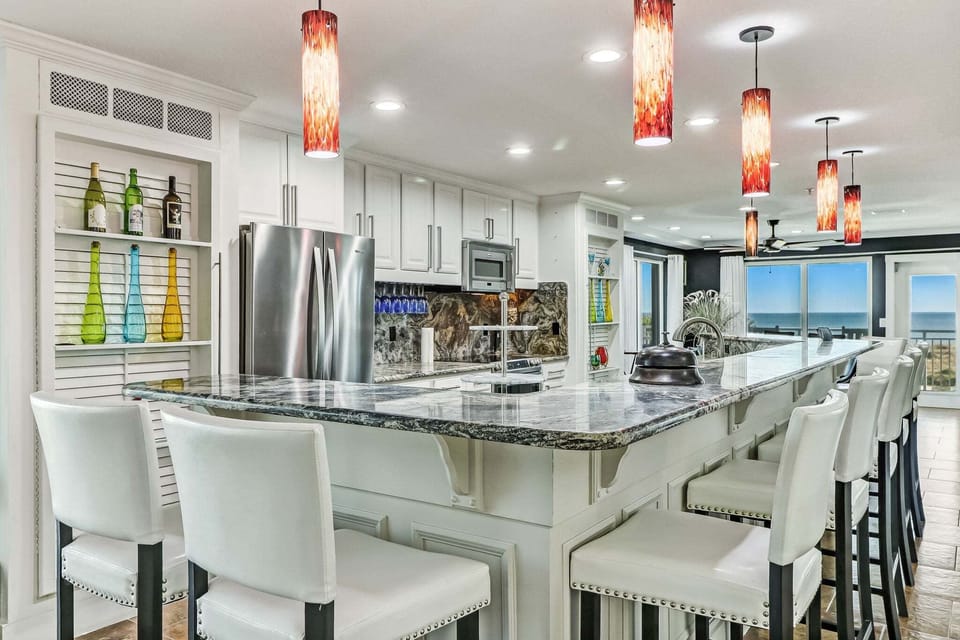 Second level fully equipped kitchen with bar seating for 10