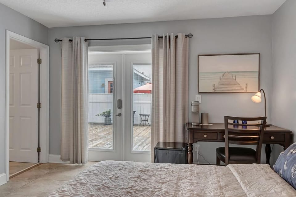 - Peek through to the private outdoor space from your room’s built in workstation with lamp and art accents
- Peaceful nook for morning coffee, journaling, or remote work
- Easy access to the deck lets fresh air and sunlight in