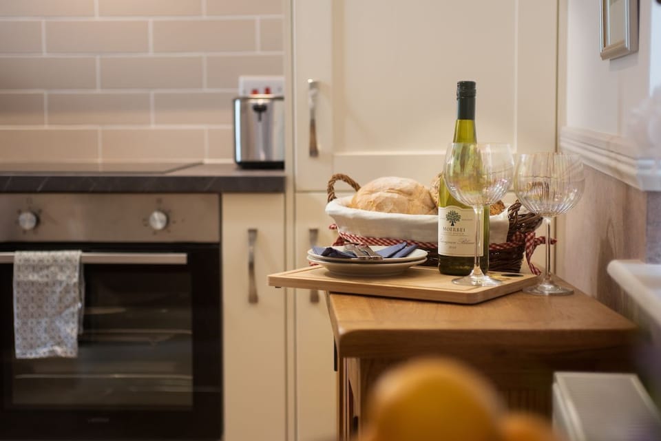 Eildon View - sideboard in kitchen providing extra storage and the essentials for your self-catered stay