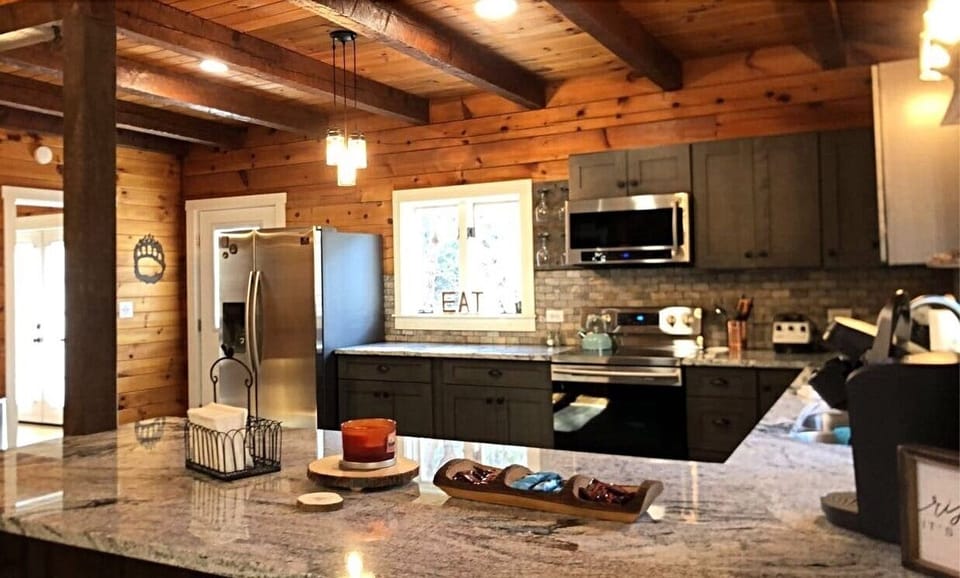 Freshly renovated kitchen with granite countertops and new appliances. 