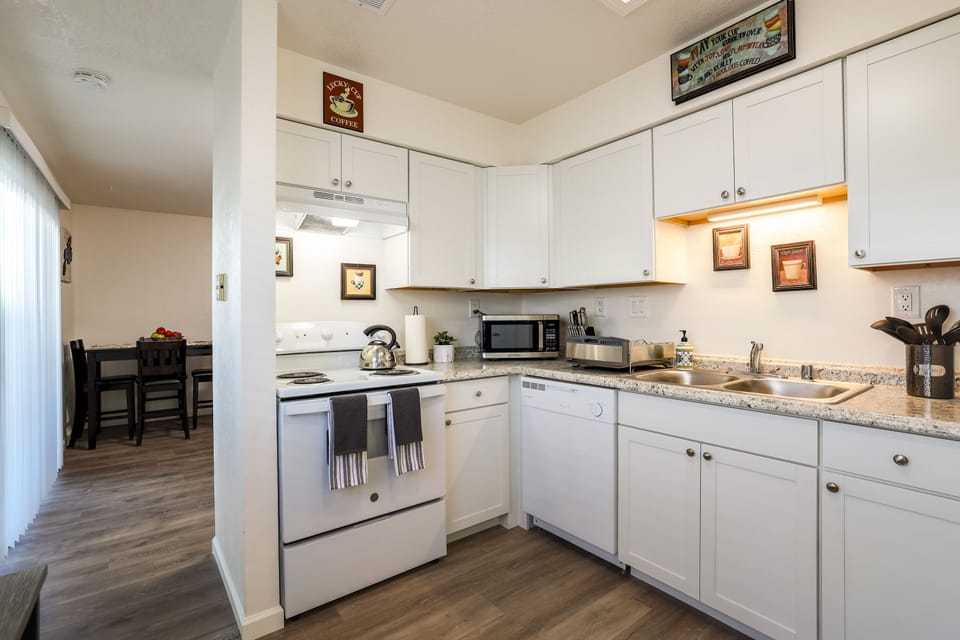 Beautifully remodeled kitchen stocked with cooking and spice basics