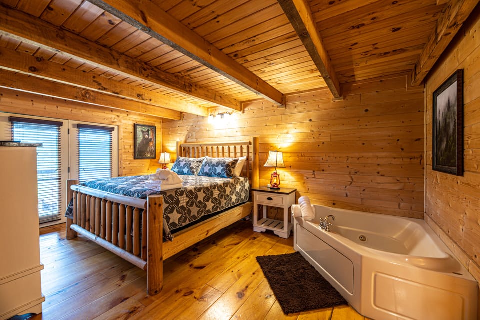 Main level guest suite with vintage bedframe typical from the Smokies
