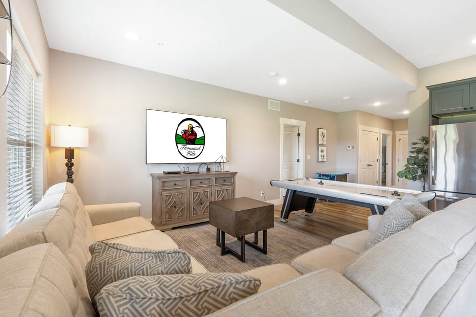 Downstairs Recreation room with Air Hockey and Sit Down Arcade, Galley Style Kitchen
