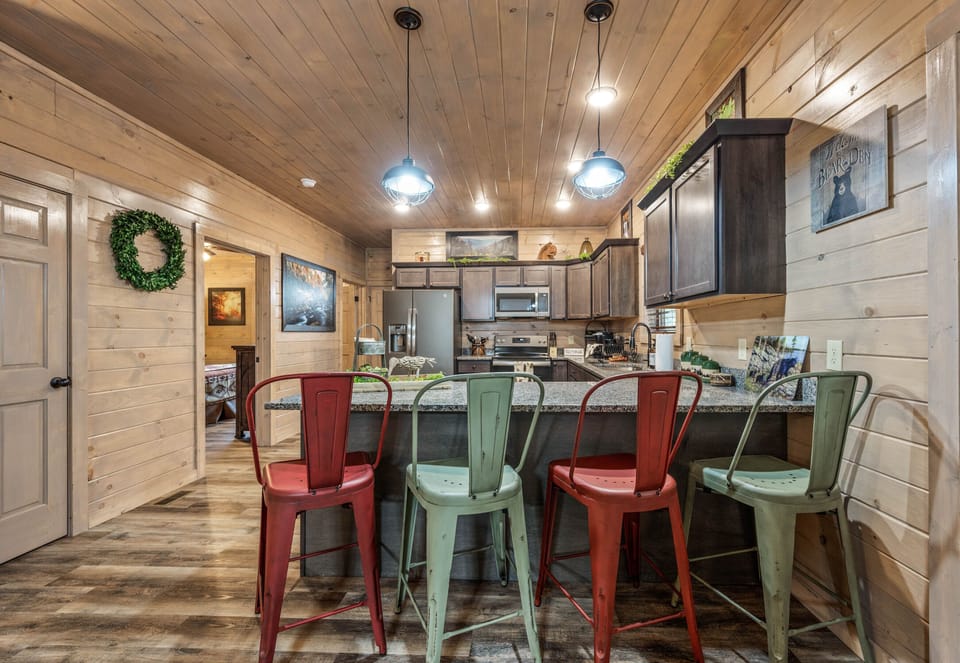 Kitchen, with side view of bedroom downstairs.
