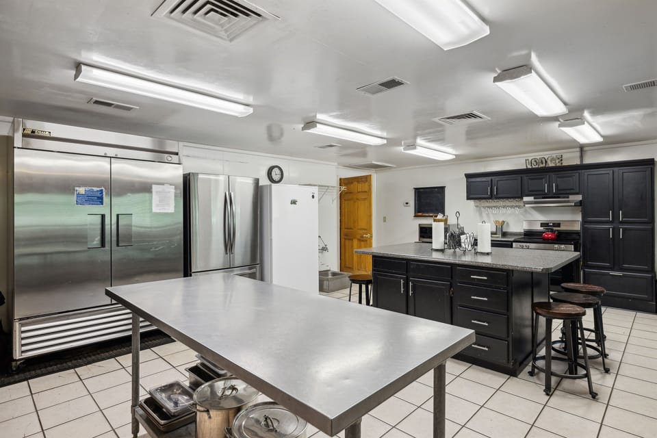 Huge kitchen! 3 fridges/freezers, 2 dishwashers, 2 gas and 1 electric stove.