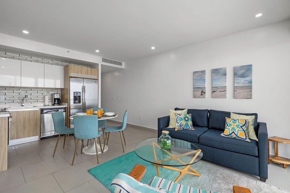 Unwind in your open-concept retreat where coastal-inspired decor meets comfort. The full kitchen flows into a sunny dining nook and living room, perfect for gathering after beach days.