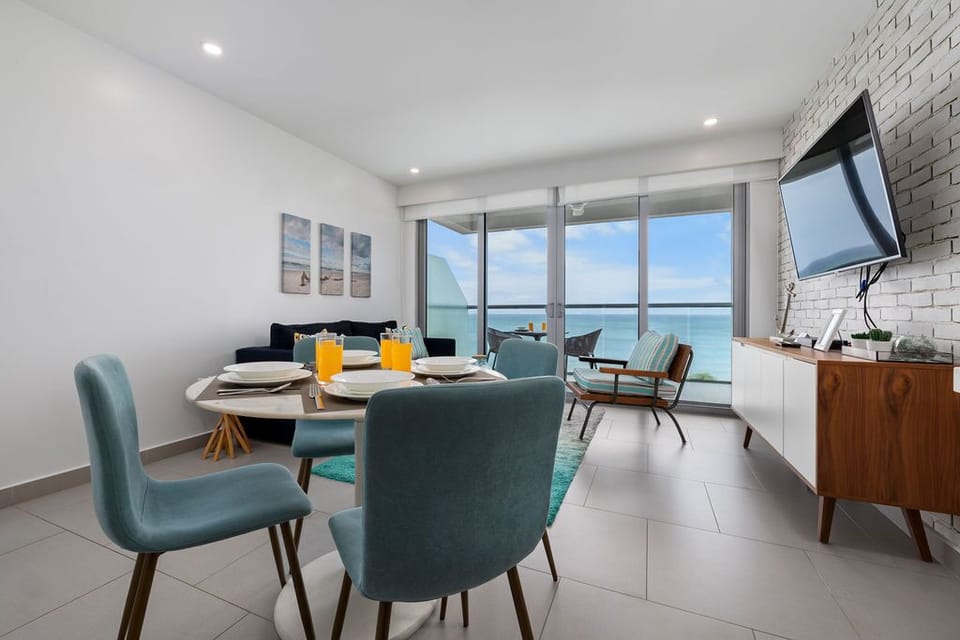 Picture yourself savoring breakfast at your dining table, ocean breezes drifting through, as stunning sea views frame your mornings in modern coastal elegance.