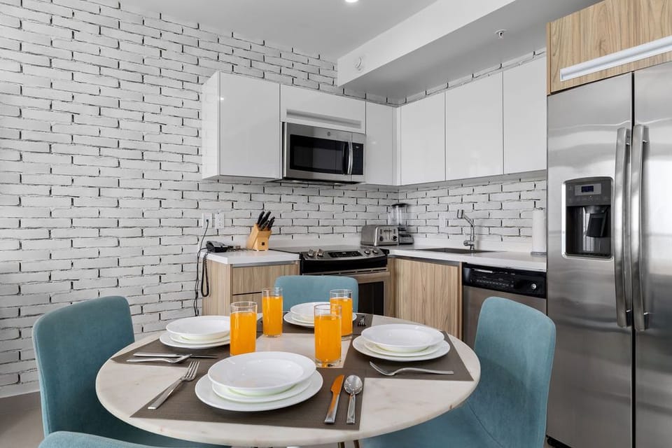 Your modern kitchen offers sleek appliances, ample counter space, and a cozy dining nook perfect for enjoying morning coffee or meals together during your stay.