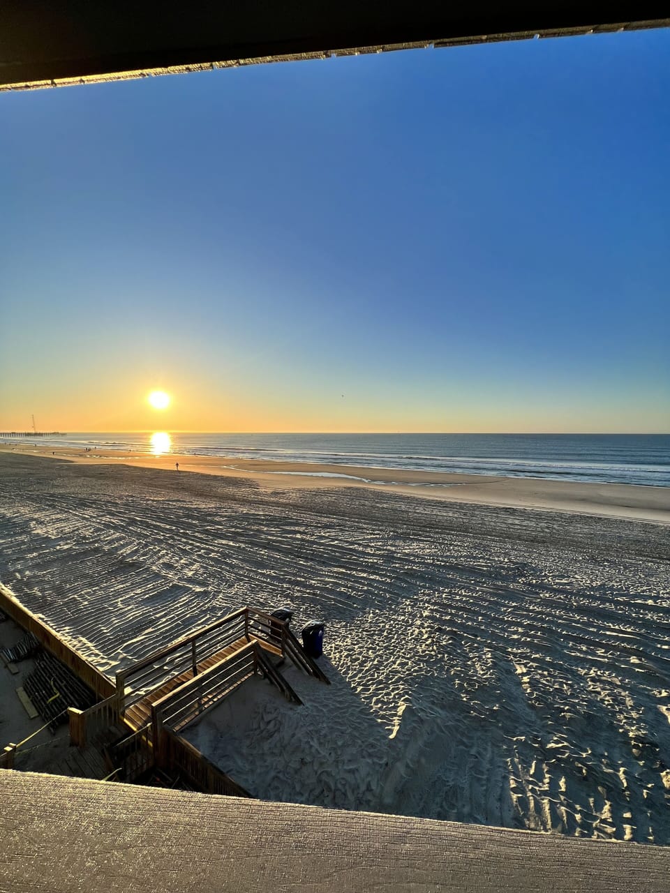 View of sun rising from balcony