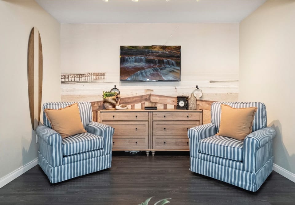 living room with wall mural of Pacific Beach (photo taken by local artist)