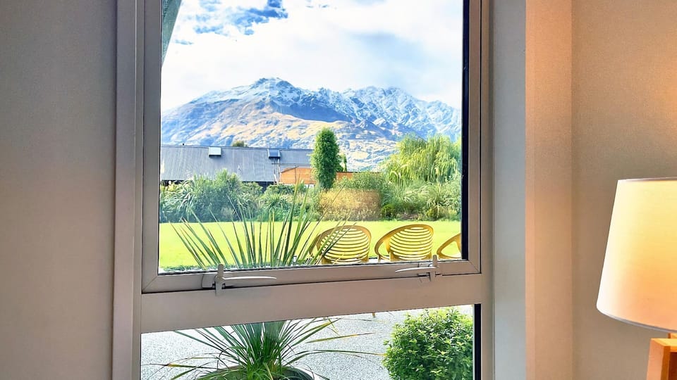 View from Bedroom 4 looking out towards the garden with The Remarkable Mountains in the distance