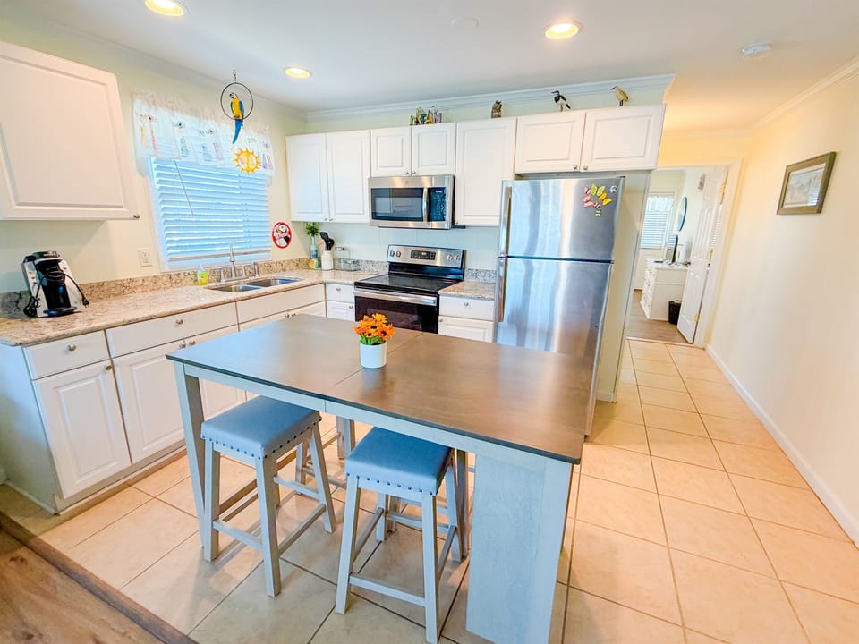 Full kitchen, with dining space.