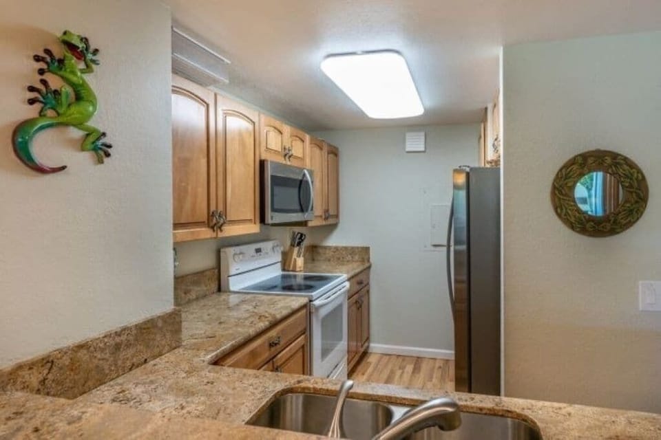 Complete kitchen with full sized appliances and granite counter tops 