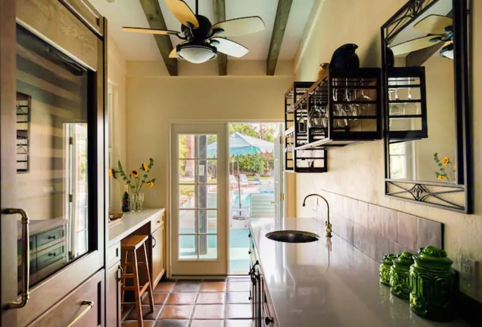 Wet bar area, built in ice maker with view out to the patio area.