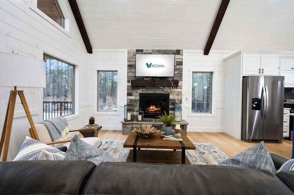 Living room includes sitting area, TV, fireplace