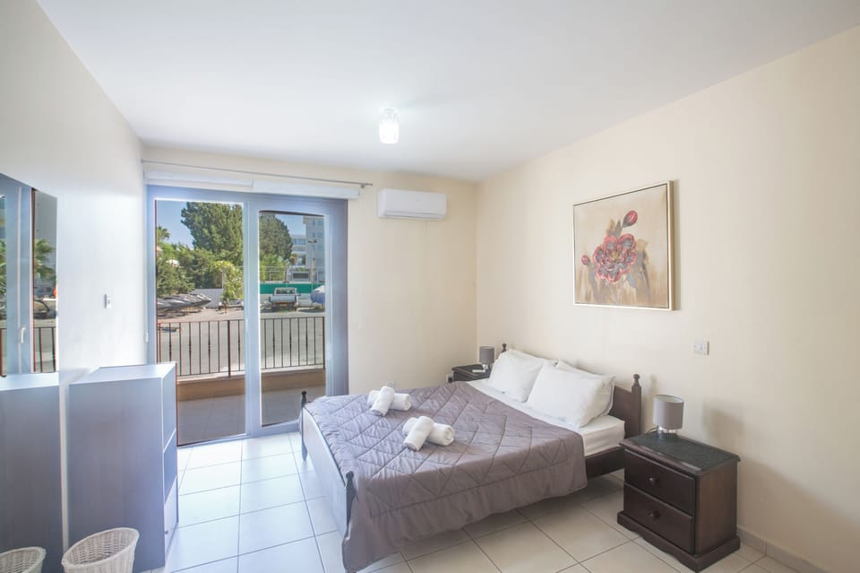 Master Bedroom with doors leading to the veranda