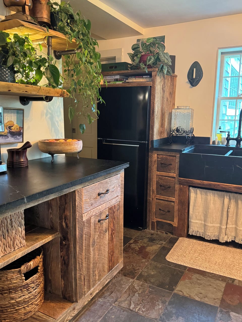 Hand crafted kitchen that is fully stocked.