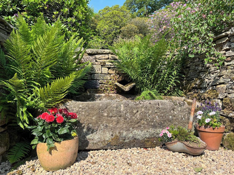 Originally a working farm, the property dates back to 1640 and there are still some original features here. Willow Cottage is formed from part of the old milking barn | Willow Cottage at Naze Farm - Naze Farm, Chinley