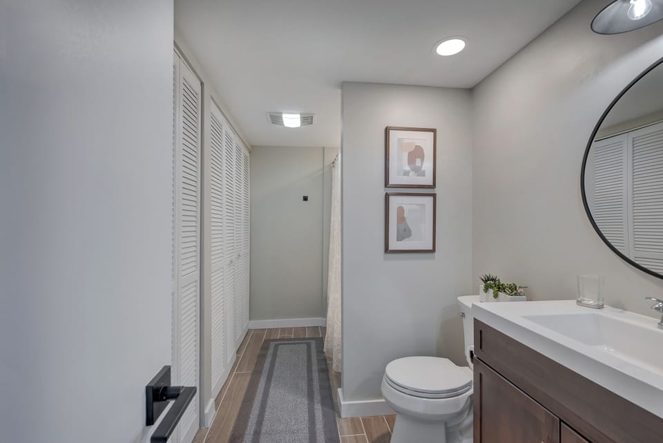 Guest bathroom has full tub/shower & sink and laundry room 