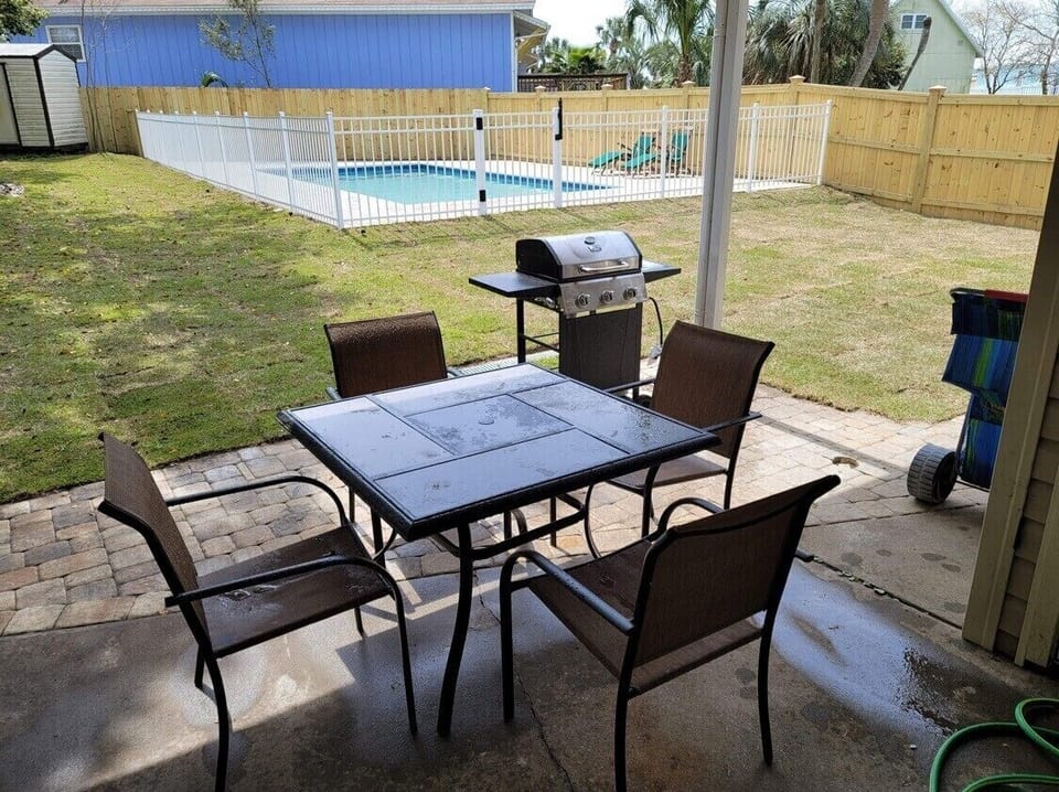 Patio is right off the living room with a nice view of pool