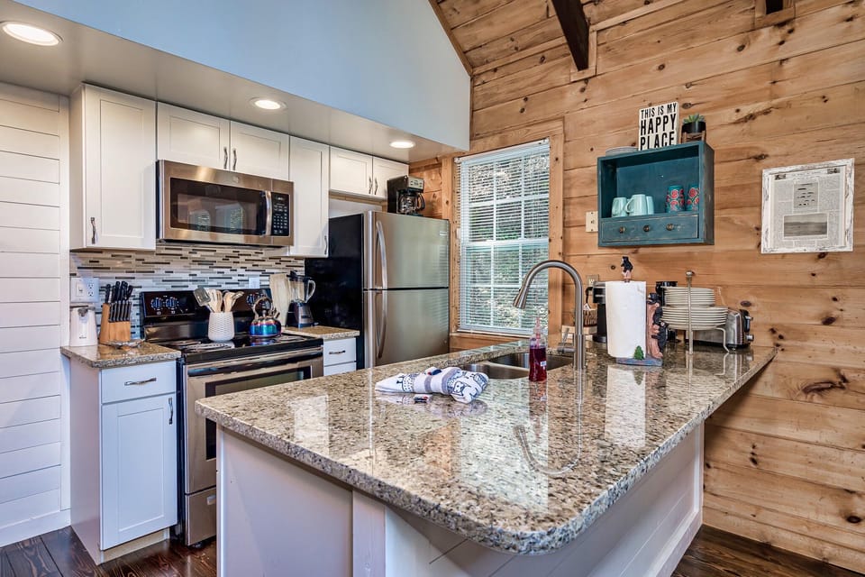 The kitchen is newly remodeled in 2021, with new stainless appliances