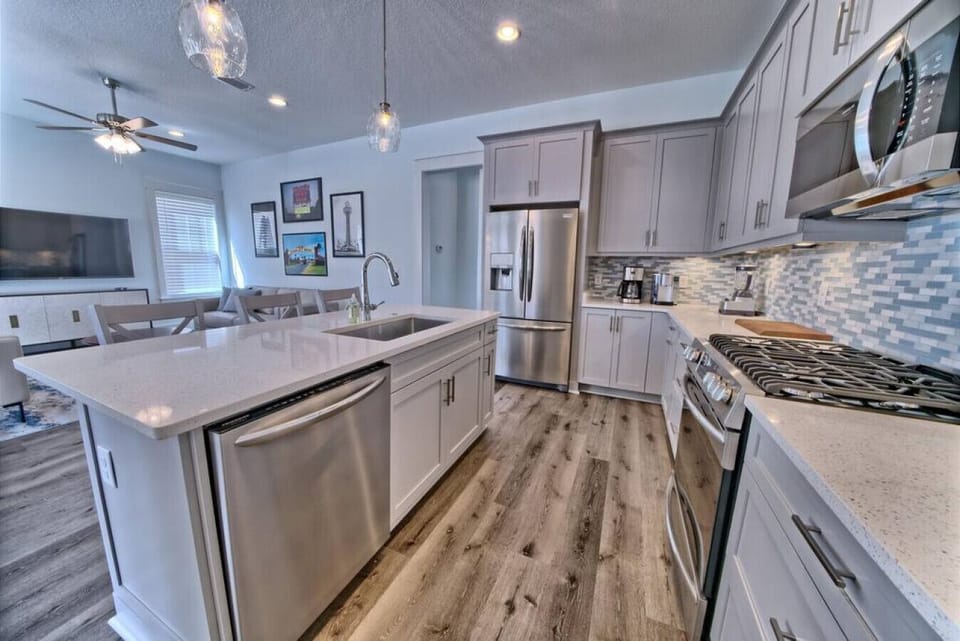 Well stocked modern kithchen with stainless steel appliances and Island