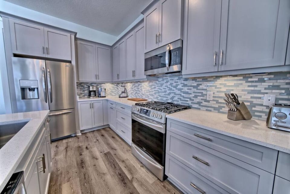 Well stocked modern kithchen with stainless steel appliances