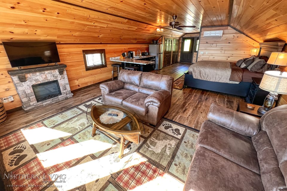 Studio w/Living Room area w/TV & Adirondack furnishings.