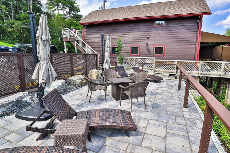 Large patio area with patio furniture for guest enjoyment