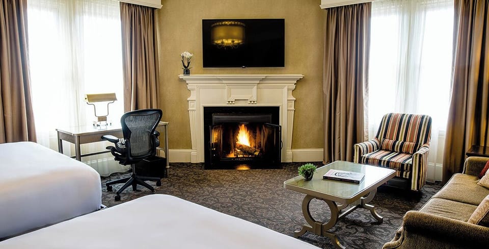 Executive Room, 2 Queen Beds, Fireplace | In-room safe, desk, laptop workspace, blackout drapes