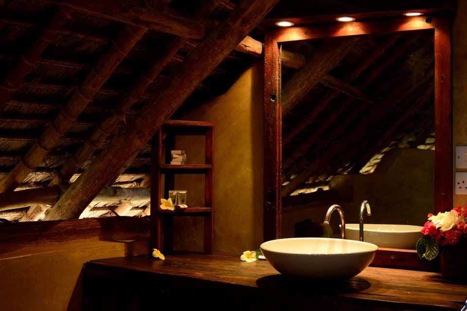 Frangipani Suite | Bathroom | Deep soaking tub, rainfall showerhead, towels