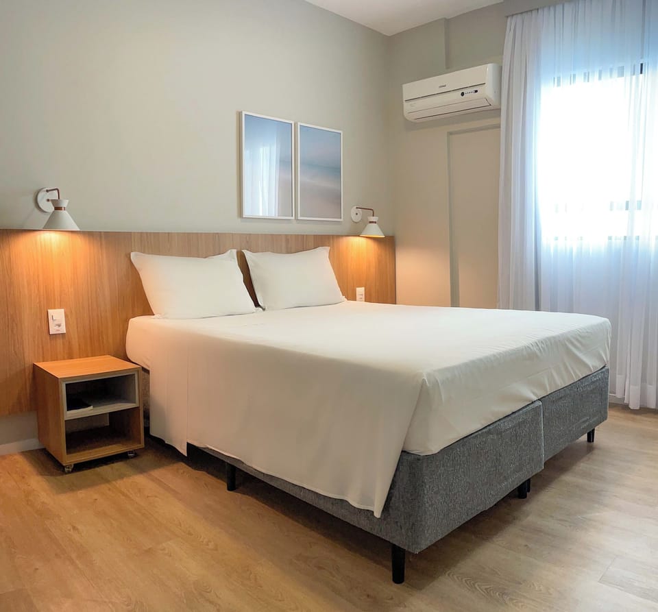 Standard Double or Twin Room | Minibar, in-room safe, desk, blackout drapes