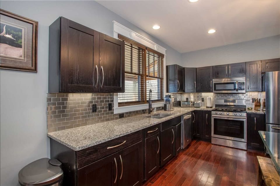 Open kitchen with stainless steel appliances