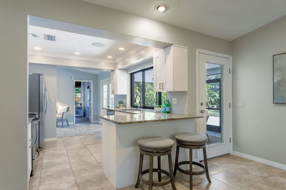 Open concept kitchen with stainless steel appliances
