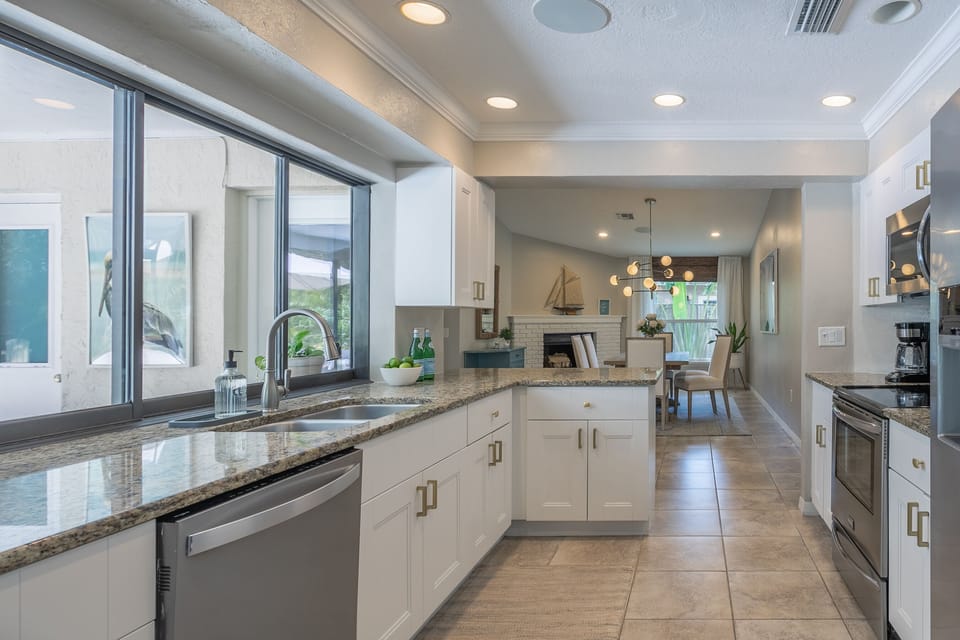 Open concept kitchen with stainless steel appliances