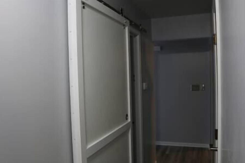 Hallway with 2nd bathroom on way to bedrooms!
