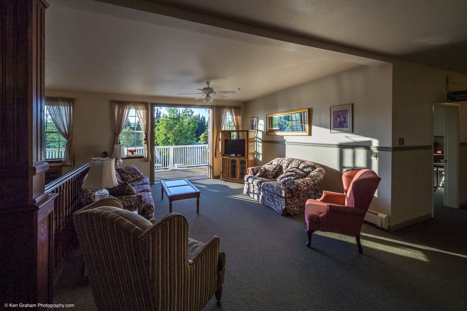 Suite, 1 King Bed | Living area | 32-inch LED TV with cable channels, TV