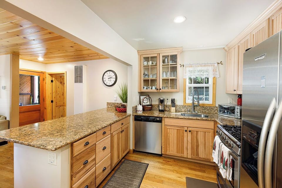 Kitchen with updated appliances and granite counters