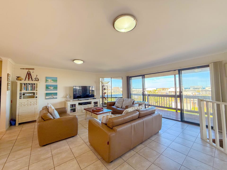 Upstairs lounge area, Leather lounges, leads on to large balcony, dining for 10