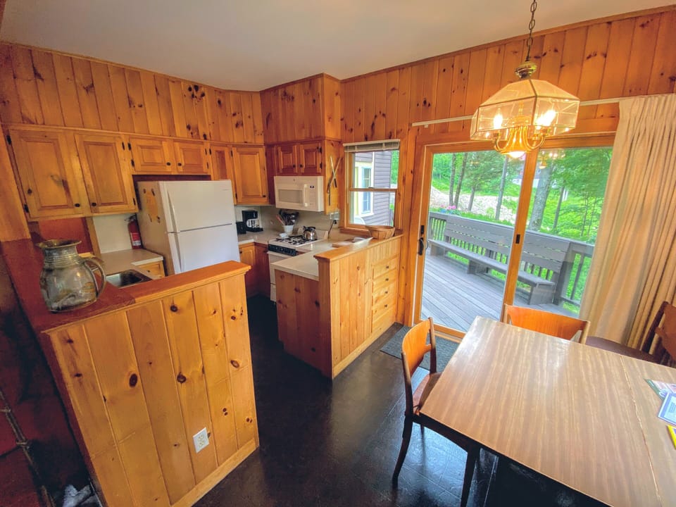 Another view of the kitchen and dining room leading to the back deck.