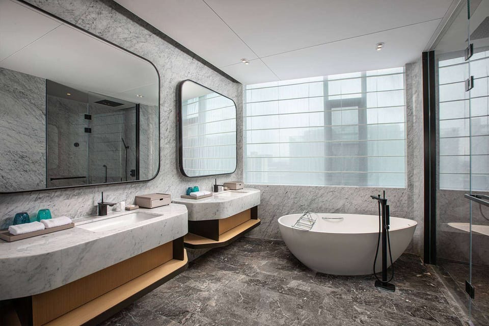 Junior Suite, 1 King Bed | Bathroom | Eco-friendly toiletries, hair dryer, bathrobes, slippers