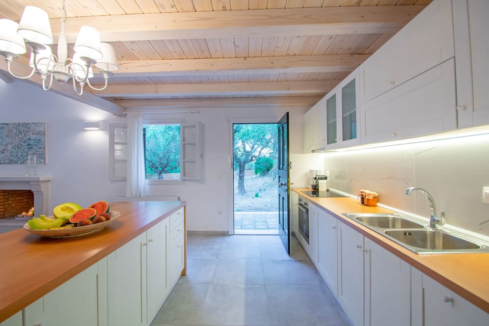 Deluxe Villa | Private kitchen | Coffee/tea maker, electric kettle, cleaning supplies, freezer