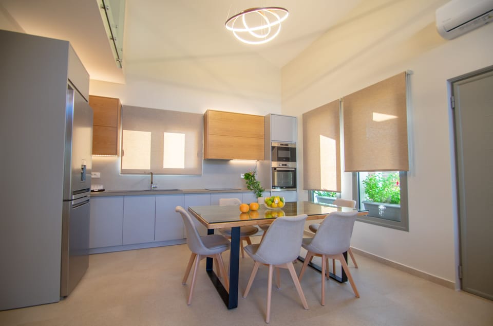 Deluxe Villa | Private kitchen | Espresso maker, coffee/tea maker, full-size fridge, microwave